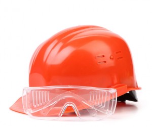 Red hard hat and glasses. Isolated on a white background.